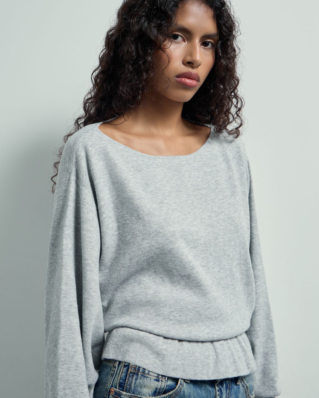BATSLEEVE PEPLUM SWEATER
