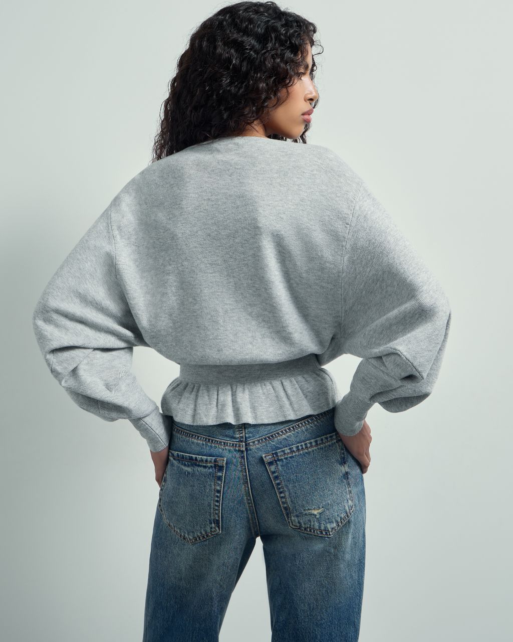 BATSLEEVE PEPLUM SWEATER