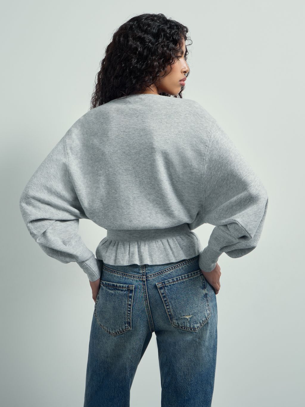 BATSLEEVE PEPLUM SWEATER